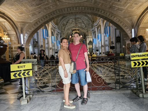 I am with Farida posing for a photo inside the Saint Augustin